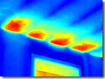 2011_IR_1816: A lack of attic insulation above a window allows heat to infiltrate a living room.