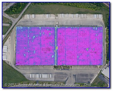 An aerial infrared roof scan reveals areas where moisture is trapped in a built up roof (BUR type construction).