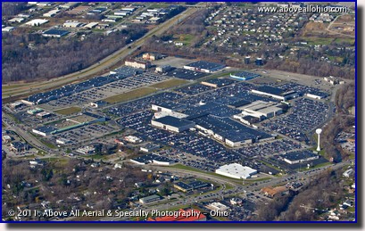 An oblique aerial view of a shopping mall in Erie, PA, packed with shoppers on Black Friday, 2011