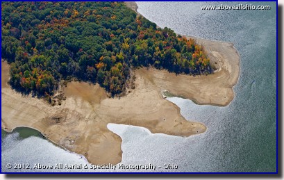 A close up aerial view of fall colors at the edge of a drought-stricken lake near Youngstown, OH.
