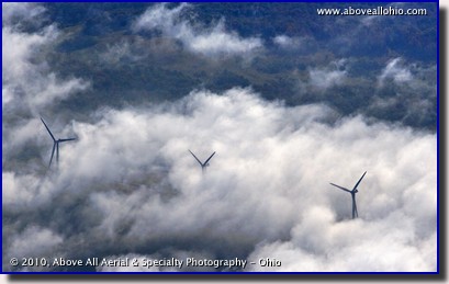 Aerial photograph of early morning fog obscuring wind turbines on a mountain ridge in West Viriginia