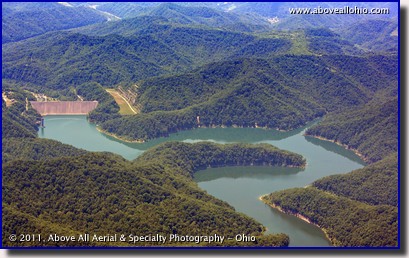 An aerial photo of a mountain reservoir and dam in southern West Virginia