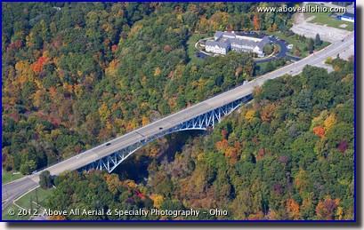 An aerial view of fall colors and the Main St bridge over the Cuyahoga River in Cuyahoga Falls, Ohio.
