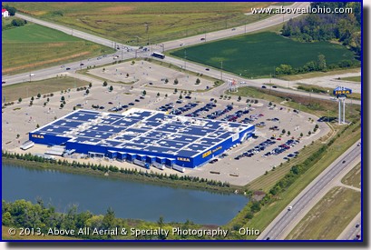 A shallow angle oblique aerial view of solar panels on the roof of an Ikea store near Cincinnati, Ohio.
