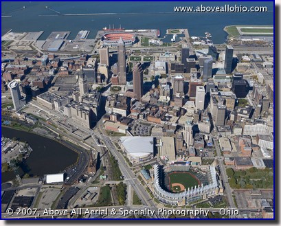 Progressive Field - formerly Jacobs Field - and downtown Cleveland Ohio. Cleveland Stadium is also visible in the background of this aerial photo.