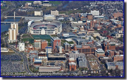 A low angle oblique aerial view of Ohio Stadium and part of The Ohio State University campus, Columbus, Ohio.