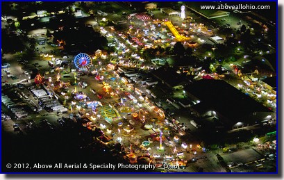 A night time aerial photo of the midway rides at the Ohio State Fair in Columbus, OH.