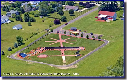 A low level aerial view of Ohio Veterans' Memorial Park in Clinton, OH, taken by helicopter.