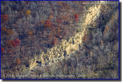 A close up aerial view of a cliff at a former mining site near Coshocton, Ohio, and a little lingering fall color.