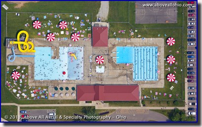 A near vertical aerial view of a couple of busy swimming pools near Mount Vernon, Ohio.