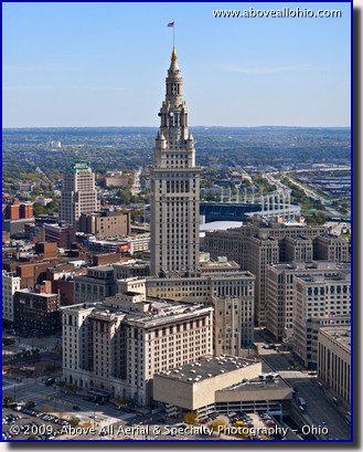 A low level aerial view of the Terminal Tower in downtown Cleveland, Ohio, taken by helicopter in early fall
