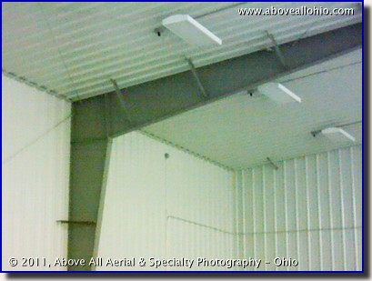 A regular photograph of an inside corner of a refrigerated metal building