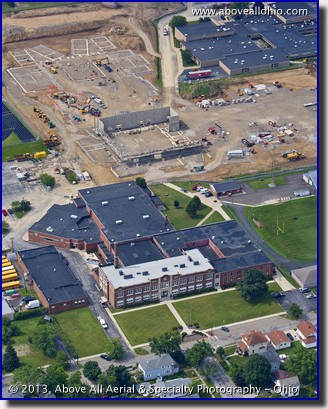 An aerial portrait of a new high school being built to replace the existing one (in the foreground) in Willard, OH.
